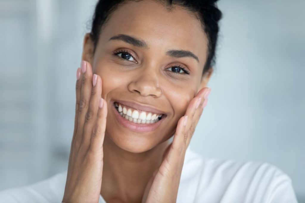 Woman touching smooth face