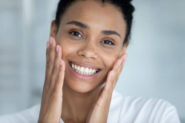 Woman touching smooth face