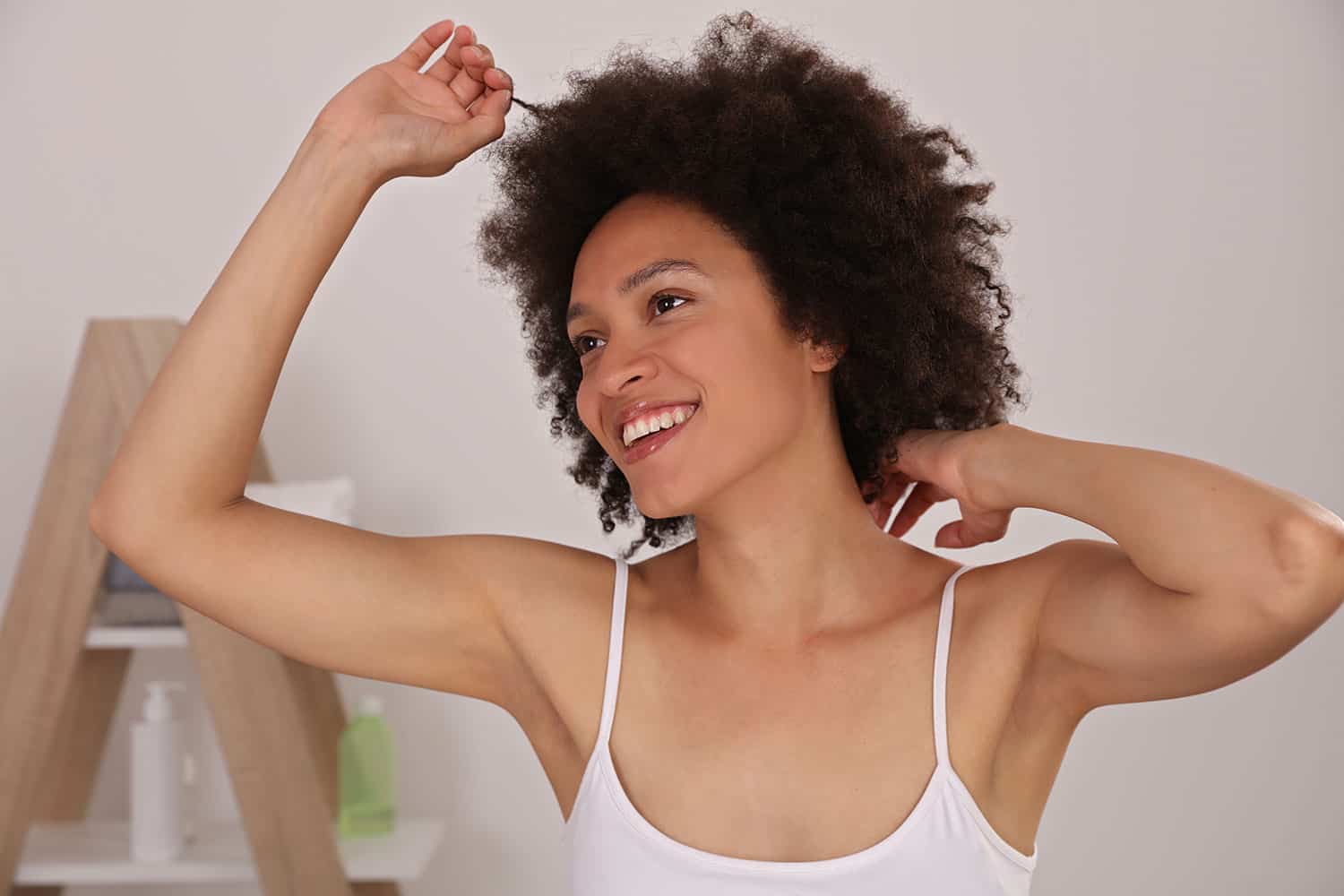 woman in white with arm raised